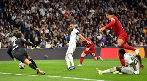 Real Madrid beat Liverpool to reach quarterfinals